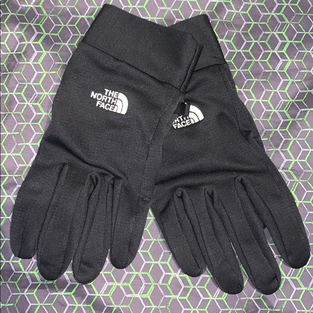 unisex L north face gloves.